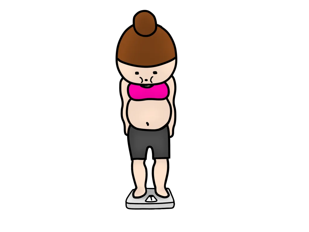 痩せない女性が体重計に乗っている