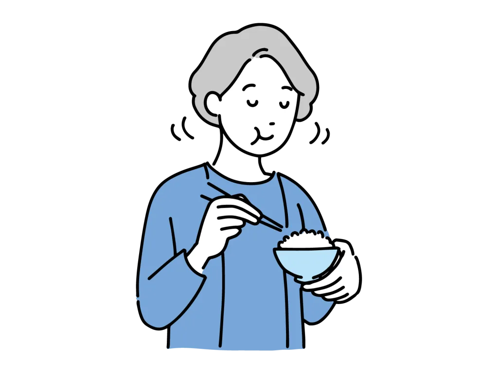 ご飯をよく噛んで食べる女性