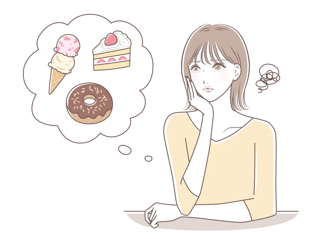 甘いものを我慢している女性